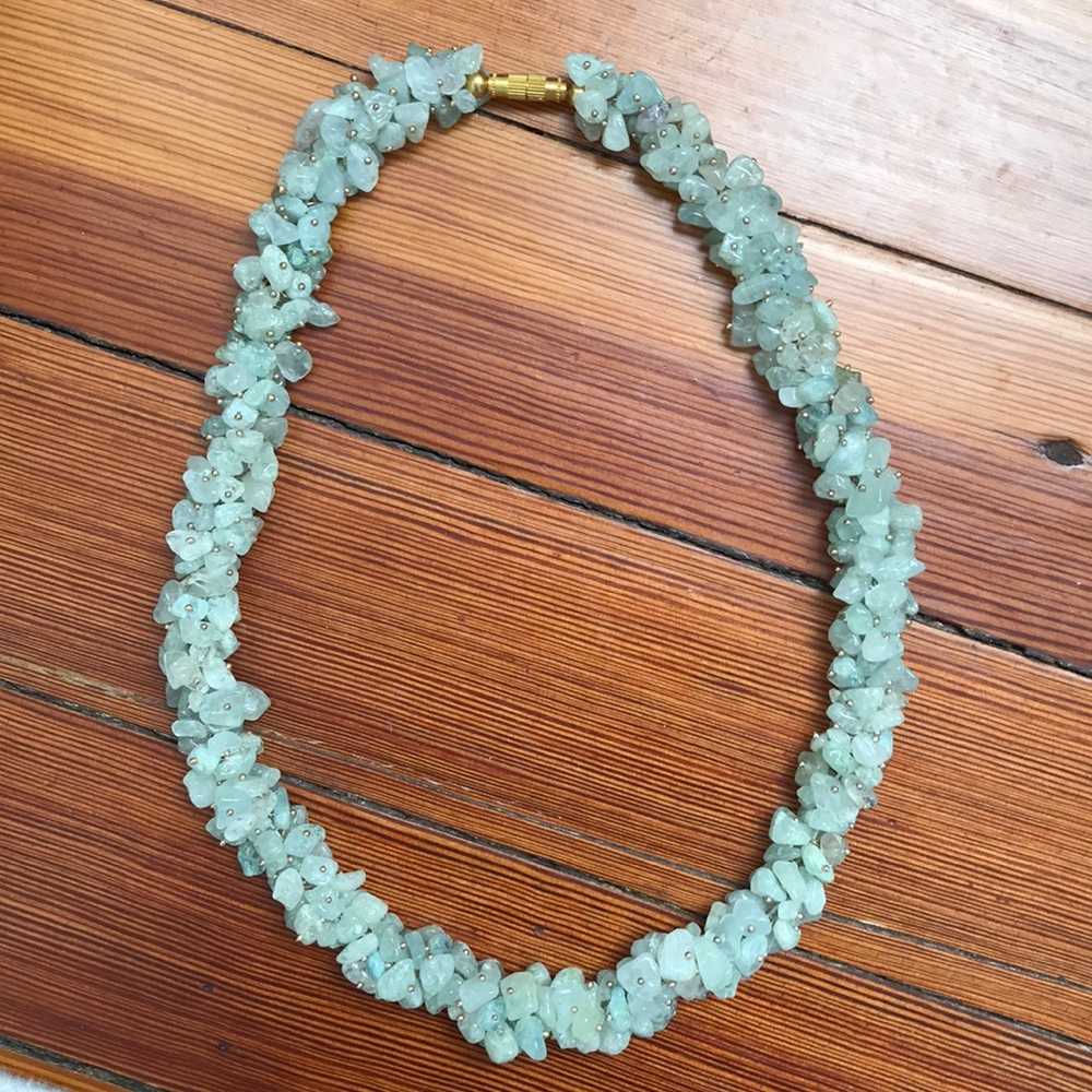 Necklace with green and hints of purple.